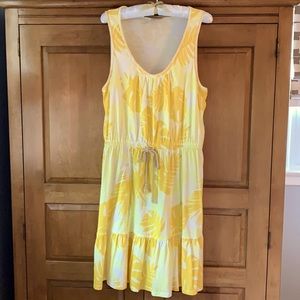 Woman’s yellow, sleeveless summer dress